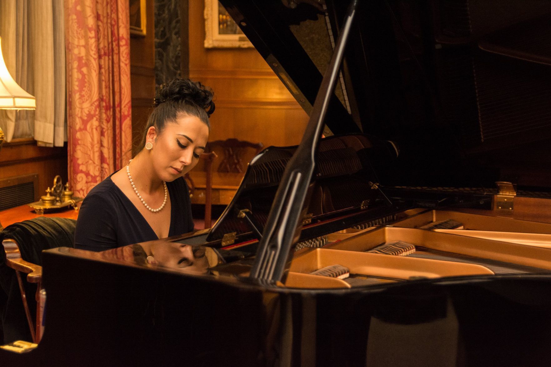 Jenn Asia performed at the MAC Wine Tasting and Sale